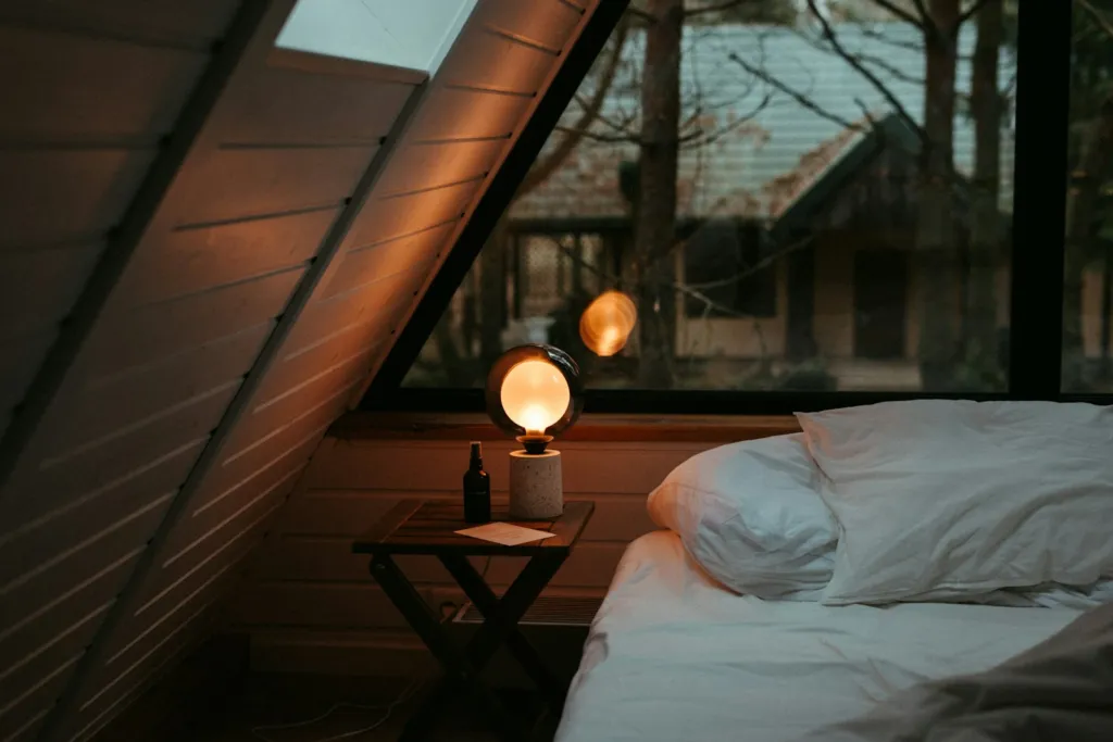 Calm bedroom with a bed under a window next to a nightstand